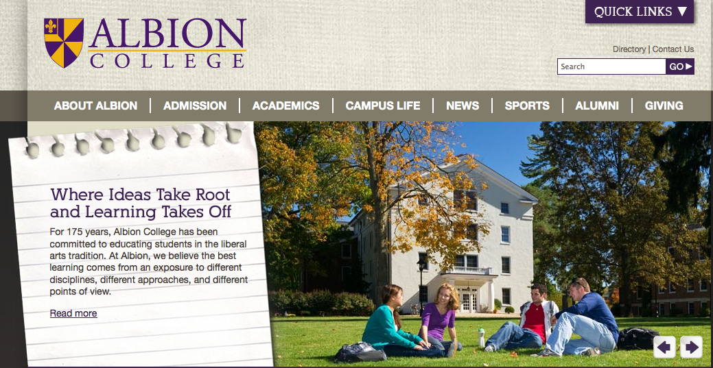 Albion College homepage photo of students sitting outside on "The Quad"
